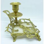 An Art Nouveau gilt metal and alabaster candle holder
