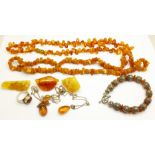 Amber jewellery; 2 necklaces, 2 silver and amber pendants, 3 brooches, a ring and a white metal