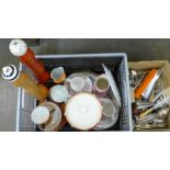 A box of mixed cutlery and china plus two tall wooden pepper mills and an ice bucket