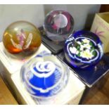 Seven Caithness glass paperweights, boxed