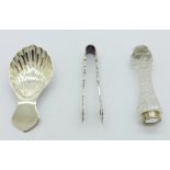 A silver caddy spoon, a pair of silver sugar bows and a knife rest