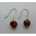 A pair of 9ct gold and garnet earrings