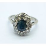 An 18ct white gold, diamond and sapphire cluster ring, 5.9g, O