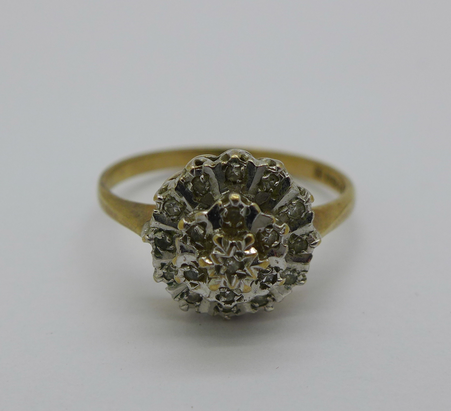 A 9ct gold and diamond cluster ring, 2.2g, N