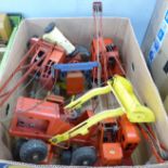 Six Tri-ang pressed steel model cranes and bulldozers