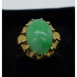 A 9ct gold ring set with jade cabochon, 3.7g, O