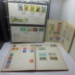 An album of First Day Covers and two stamp albums