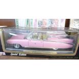 A Maisto model Cadillac in pink, Eldorado Biarritz, 1959, boxed and a collection of four Elvis