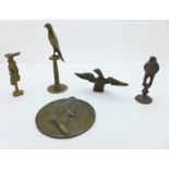 Three pipe tampers, a portrait plaque and an eagle finial
