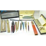 A collection of pens including Parker
