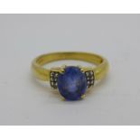 An 18ct gold, diamond and blue stone ring, 3.9g, N