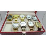A collection of nine fashion wristwatches including Stauer, in a bespoke watch case