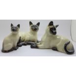Three Royal Doulton figures of Siamese cats