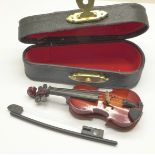 A small novelty violin, cased