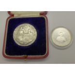 An Edward Prince of Wales Investiture medal, boxed, and a 1994 Barbodos Queen Mother one dollar