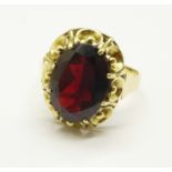 A 14ct gold and garnet ring, 4.6g, R, with certificate