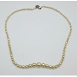 A faux pearl necklace with silver clasp, boxed