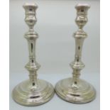 A pair of silver candlesticks, William Comyns & Sons, 26cm