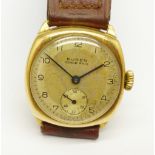 A 9ct gold Buren Grand Prix wristwatch, on leather strap, 28mm case