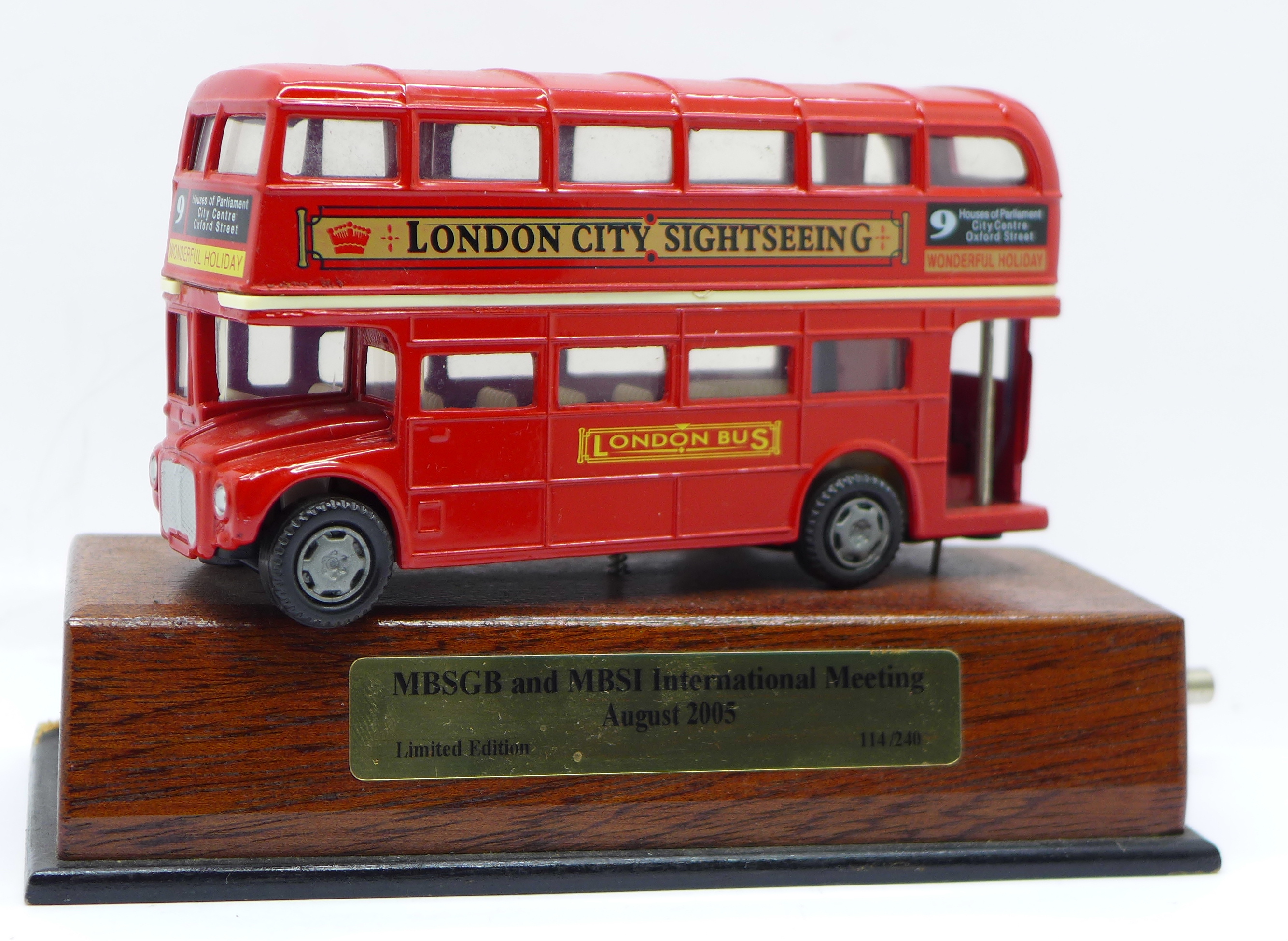 A limited edition 114/240 red die-cast London Routefinder bus with musical movement playing