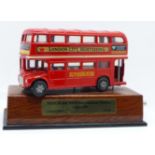 A limited edition 114/240 red die-cast London Routefinder bus with musical movement playing