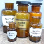 Two 19th Century apothecary jars with glass lids and three other jars with no lids