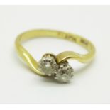 An 18ct gold, two stone diamond twist ring, 2.6g, L