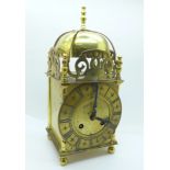 A brass lantern clock with Shatz of Germany movement