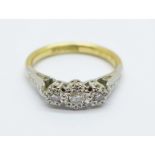 An 18ct gold, three stone diamond ring, 2.9g, K