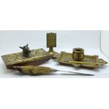 A brass inkwell, a brass blotter, a letter opener and match box holders