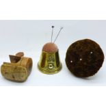 A 19th Century treen table fastening pin cushion, a table fastening pin cushion and a brass trench