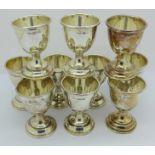 Ten silver egg cups, approximately 310g