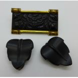 An Art Deco black glass and gilt metal brooch with black glass leaf dress clips