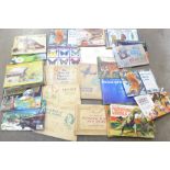 A collection of cigarette card and tea card albums, approximately thirty