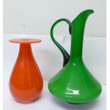 Two clear glass vases encasing green or orange interiors, each with pontil marks, tallest 32cm