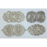 Four hallmarked silver buckles, 236g