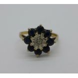 A 9ct gold, diamond and sapphire cluster ring, 2g, K