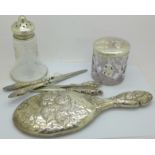 Two pair of silver handled glove stretchers, a silver hand mirror and silver topped jar both