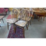 A set of four elm and beech Windsor kitchen chairs, stamped Aple & Co., 1915