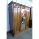 A Victorian walnut three door wardrobe