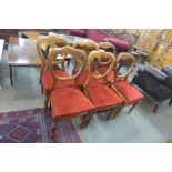 A set of four Victorian walnut balloon back dining chairs and another pair similar