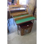 An oak nest of tables, folding table and two oak wall racks