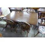 An oak refectory table and four beech wheelback chairs