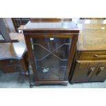 A mahogany astragal glazed single door bookcase