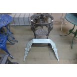 A cast iron pub table base and an enamelled cast iron cistern bracket