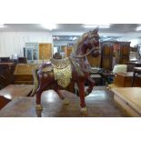 An oriental painted carved wood stallion