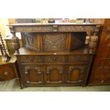 A 17th Century style carved oak court cupboard