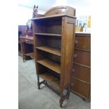 A carved oak open bookcase