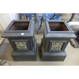 A pair of Victorian style cast iron urn stands