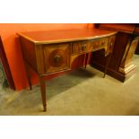 An Edward VII Maple & Co. inlaid mahogany bow front three drawer writing table